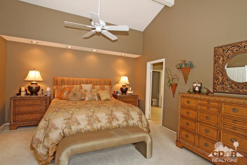 332 Red River Road Palm Desert, CA 92211 - Photo 23 of 40 a bedroom with a bed and a dresser