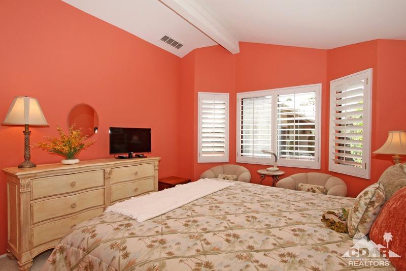 332 Red River Road Palm Desert, CA 92211 - Photo 29 of 40 a bedroom with a bed and a flat tv screen on dresser