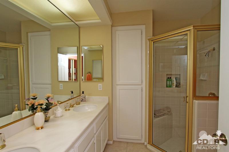 332 Red River Road Palm Desert, CA 92211 - Photo 31 of 40 a bathroom with a sink and mirror with shower
