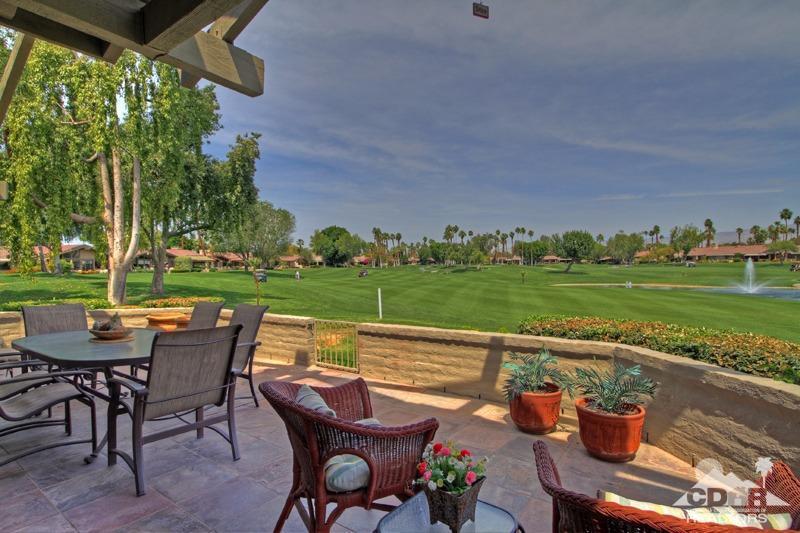 332 Red River Road Palm Desert, CA 92211 - Photo 33 of 40 a view of a chairs and table in patio with a yard