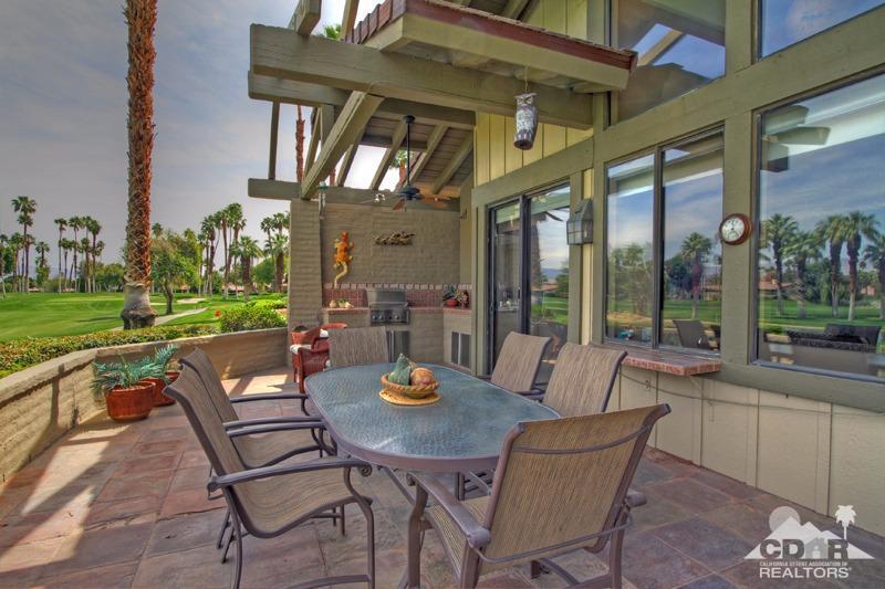 332 Red River Road Palm Desert, CA 92211 - Photo 36 of 40 a view of an outdoor dining space with a table and chairs