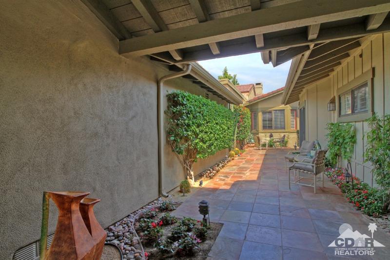 332 Red River Road Palm Desert, CA 92211 - Photo 6 of 40 a view of a porch with furniture and a potted plant