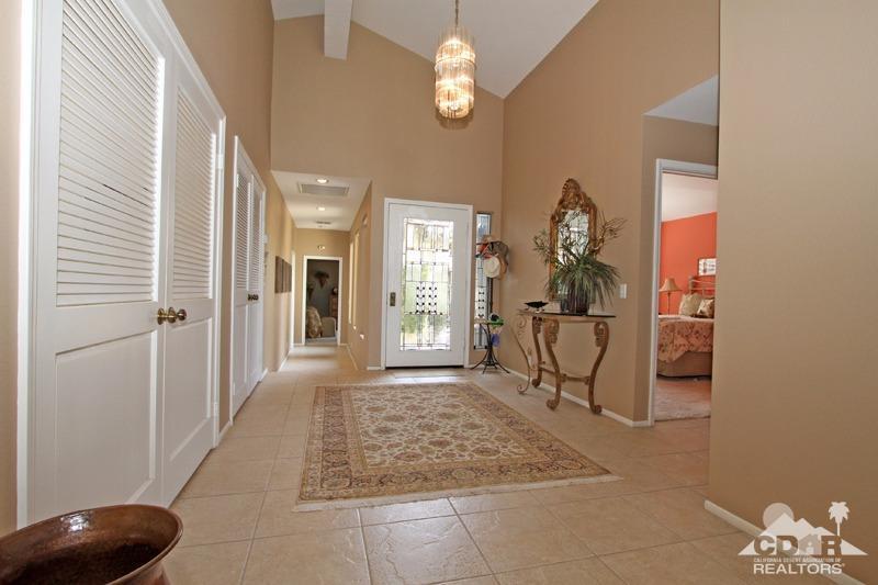 332 Red River Road Palm Desert, CA 92211 - Photo 8 of 40 a view of a livingroom with furniture and a chandelier