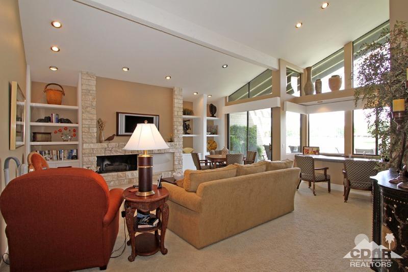 332 Red River Road Palm Desert, CA 92211 - Photo 9 of 40 a living room with furniture and a chandelier
