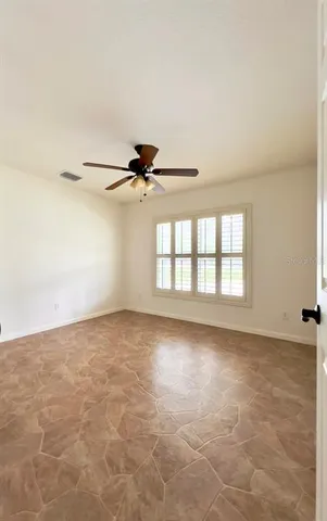 a large white kitchen with a sink