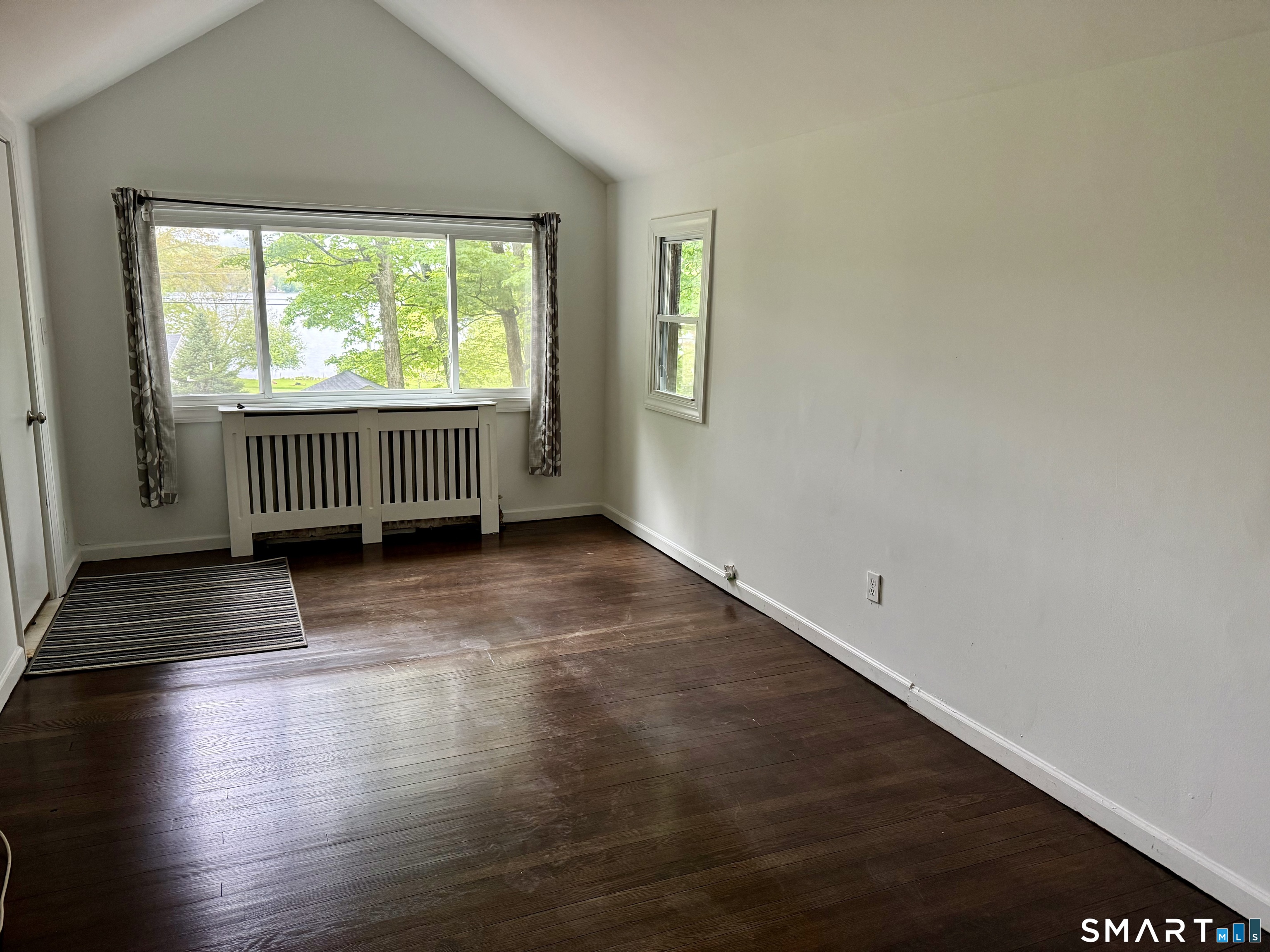 277 Lake Road Andover, CT 06232 - Photo 15 of 18 a view of empty room with wooden floor and fan