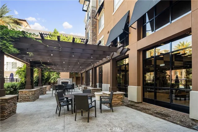 a patio with a table and chairs