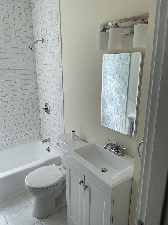 840 South Street, Unit 1 Boston, MA 02131 - Photo 11 of 19 a bathroom with a sink toilet and shower