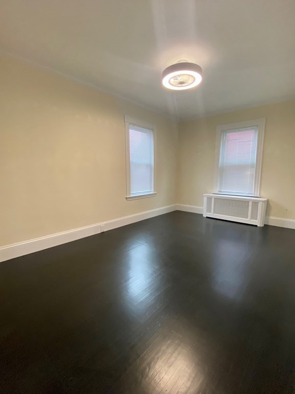 840 South Street, Unit 1 Boston, MA 02131 - Photo 6 of 19 a view of room with hardwood floor