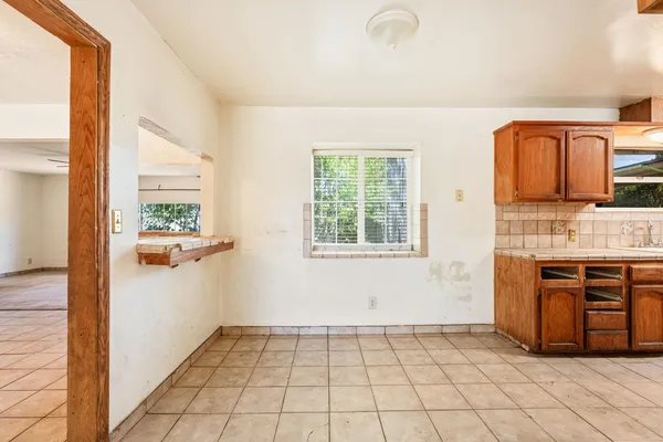 a bathroom with stainless steel appliances granite countertop a large stove and a sink