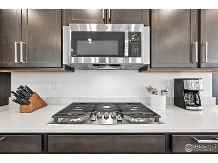 a kitchen with a stove and cabinets