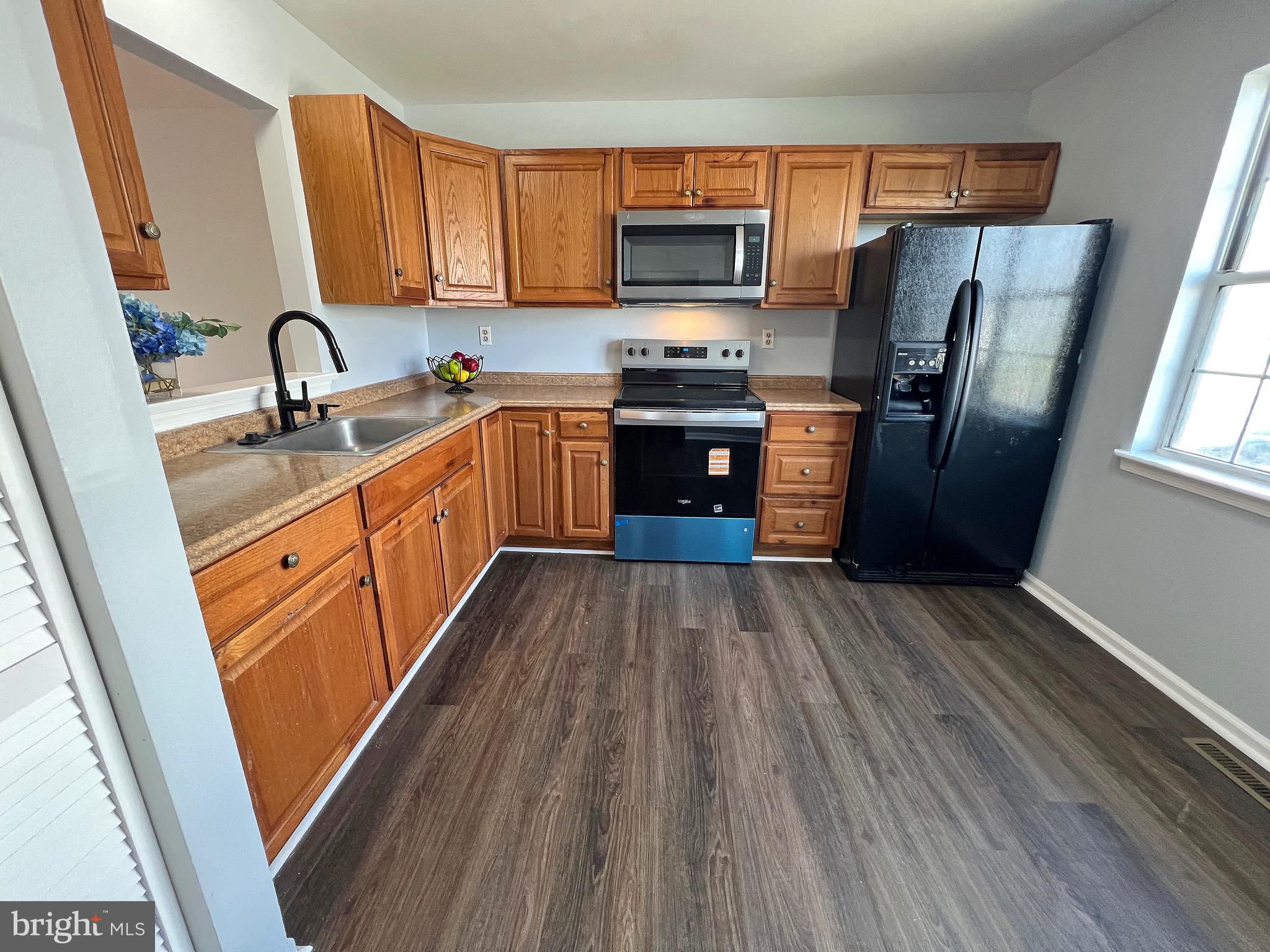 1049 Old Forge Road New Castle, DE 19720 - Photo 2 of 27 Renovated kitchen open to the living & dining room