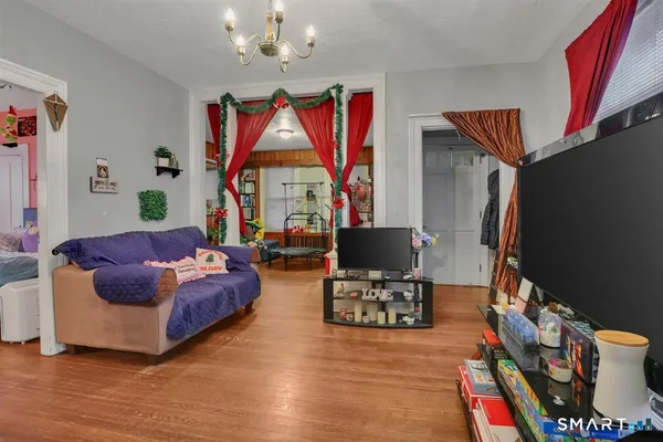 a living room with furniture and a flat screen tv