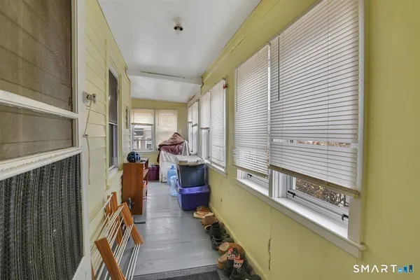 a view of a living room with furniture and a window