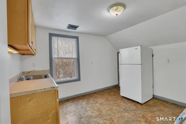 a view of storage and utility room with washer and dryer