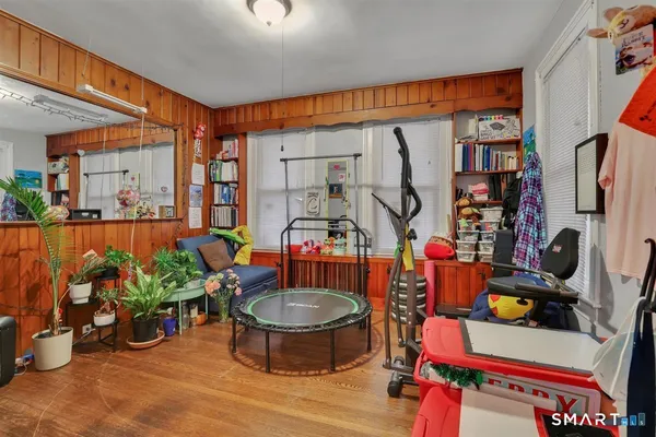 a room with lots of furniture and gym equipment