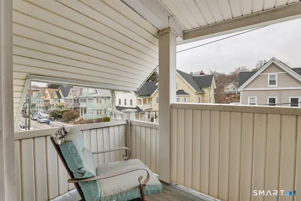 a view of a balcony with furniture