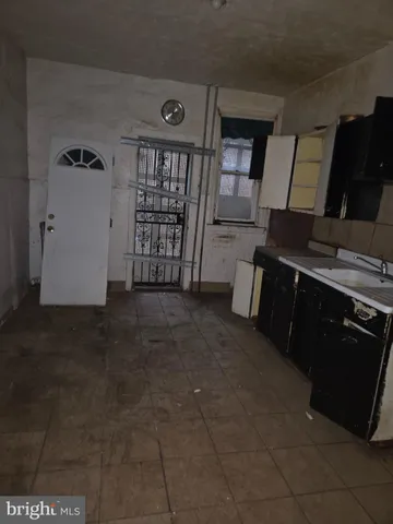 a view of a livingroom with an empty space and window