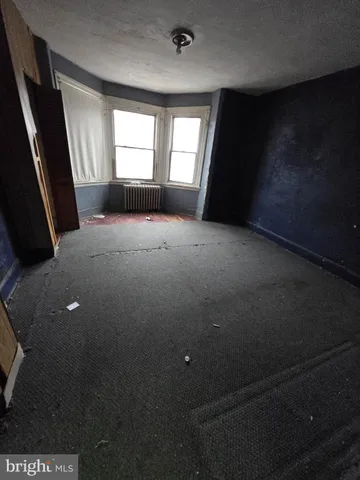 a room with wooden walls and stairs