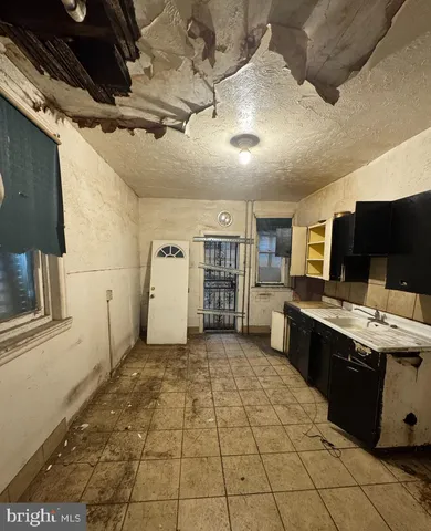 a view of a kitchen with furniture and window