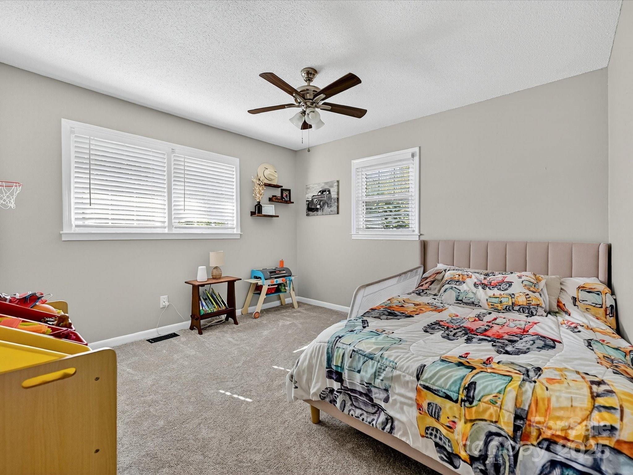 791 Sutton Spring Road York, SC 29745 - Photo 20 of 31 a bedroom that has a bed and a table in it