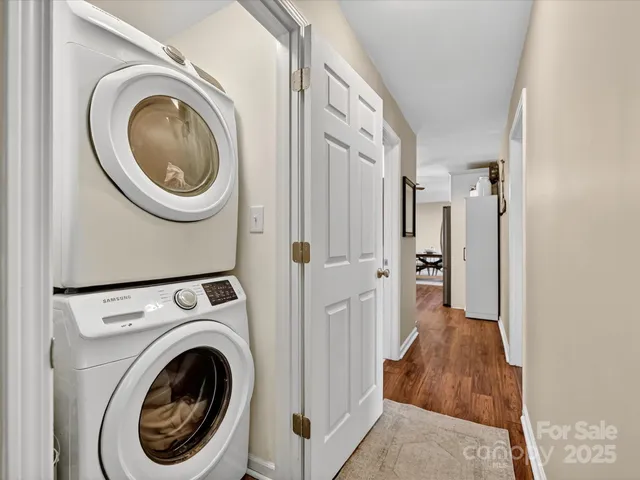 a view of a hallway with washer and dryer