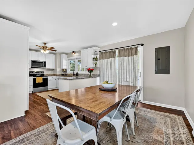 a kitchen with a table and chairs in it