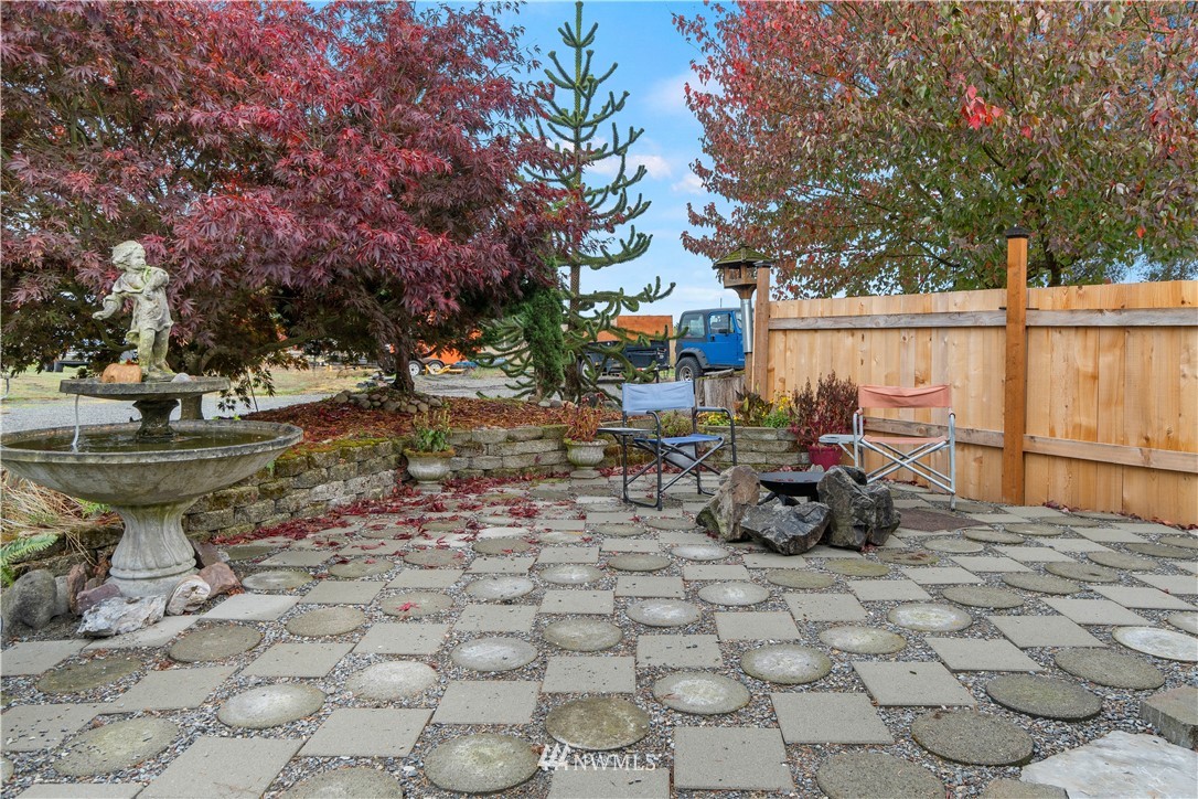 16441 Gibson Road Southwest Tenino, WA 98589 - Photo 22 of 26 a view of a backyard with table and chairs