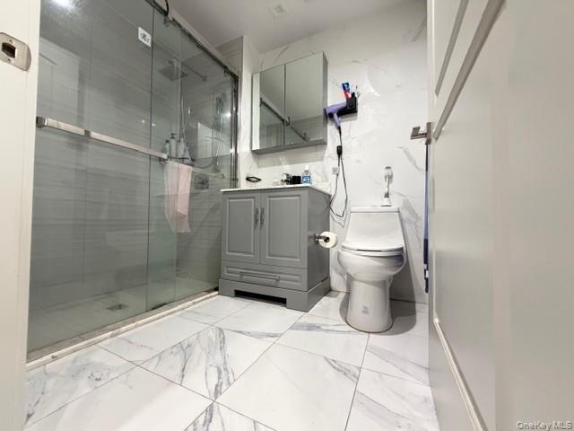 41-62 Bowne Street, Unit 9F Queens, NY 11355 - Photo 9 of 25 a bathroom with a toilet and a shower