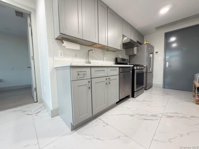 41-62 Bowne Street, Unit 9F Queens, NY 11355 - Photo 10 of 25 a kitchen with stainless steel appliances granite countertop a sink stove and refrigerator