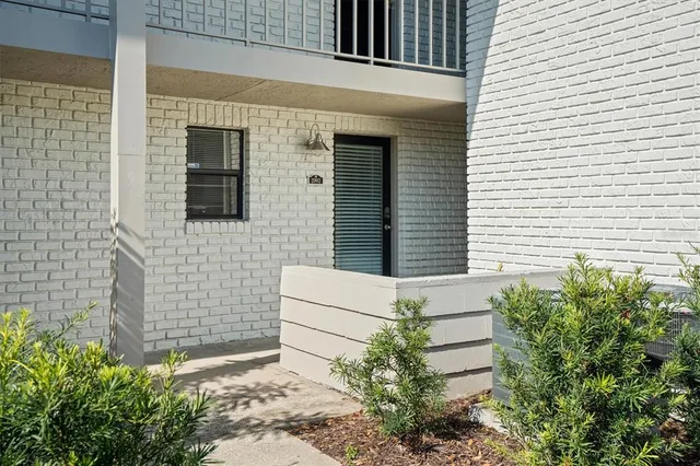 a view of house with backyard
