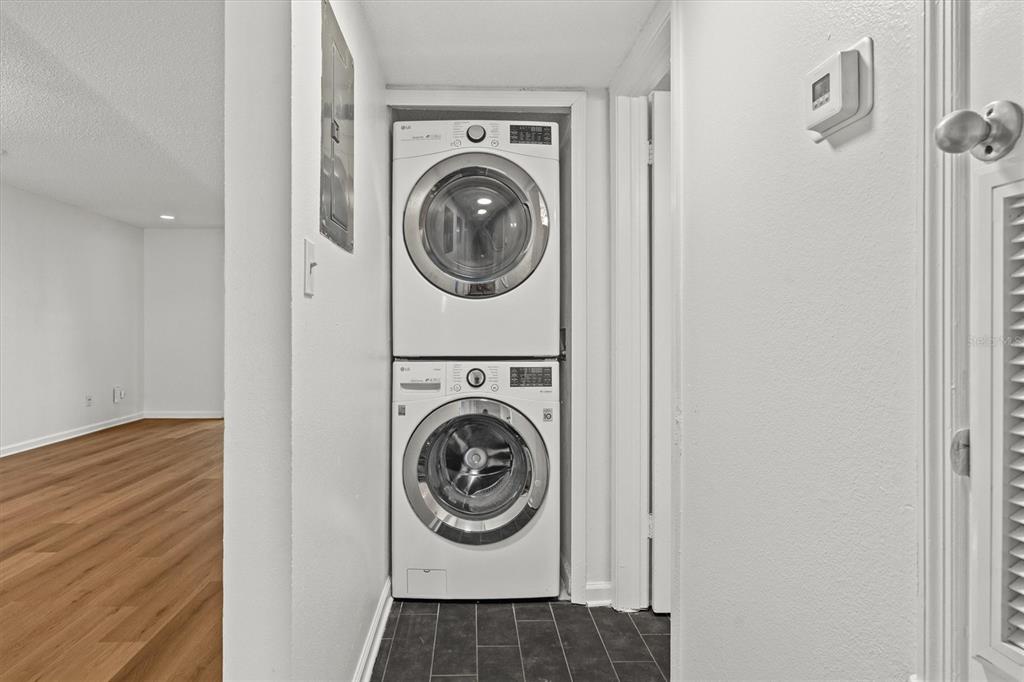 2992 Plaza Terrace Drive, Unit 2992 Orlando, FL 32803 - Photo 13 of 31 a utility room with dryer and washer