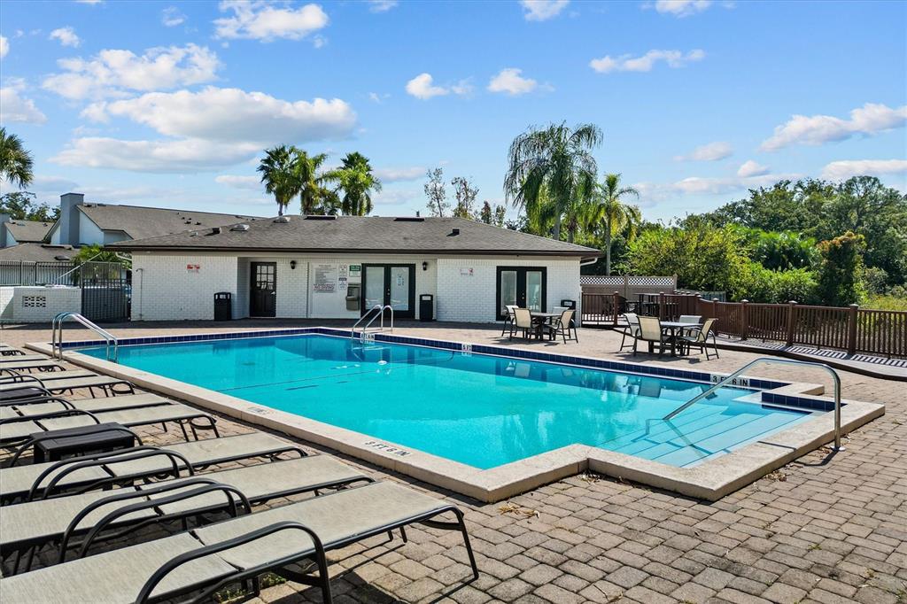 2992 Plaza Terrace Drive, Unit 2992 Orlando, FL 32803 - Photo 23 of 31 a house with swimming pool in front of it