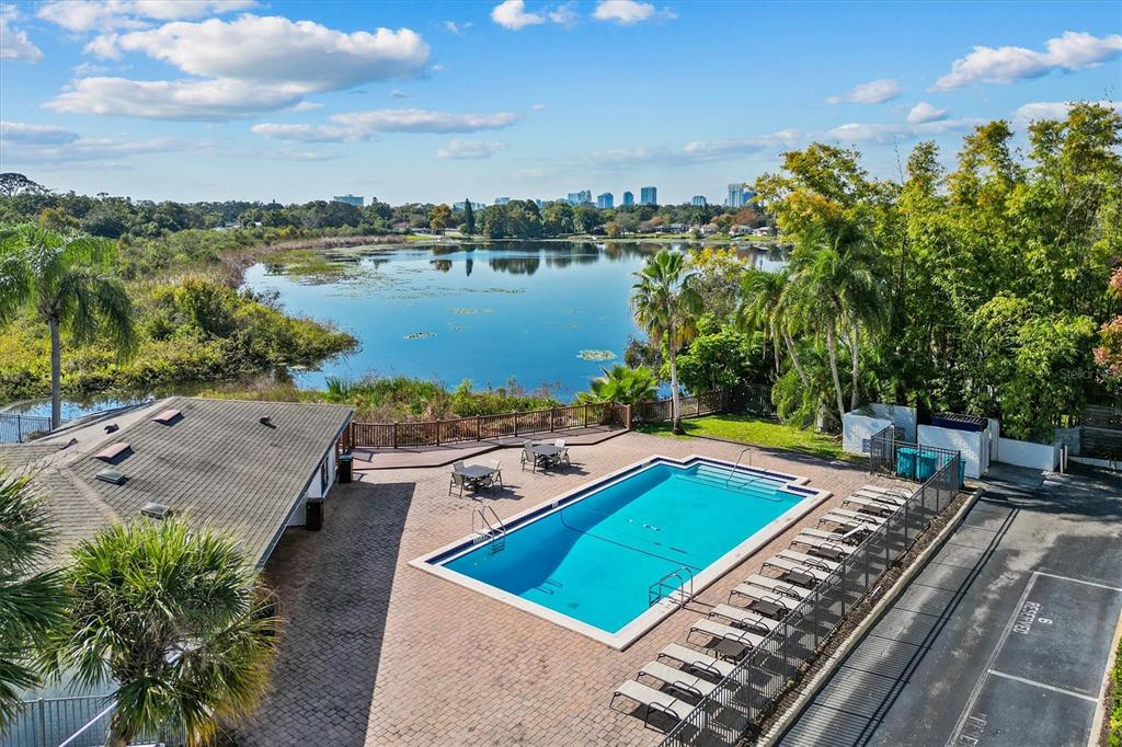 2992 Plaza Terrace Drive, Unit 2992 Orlando, FL 32803 - Photo 24 of 31 a view of a backyard with sitting area