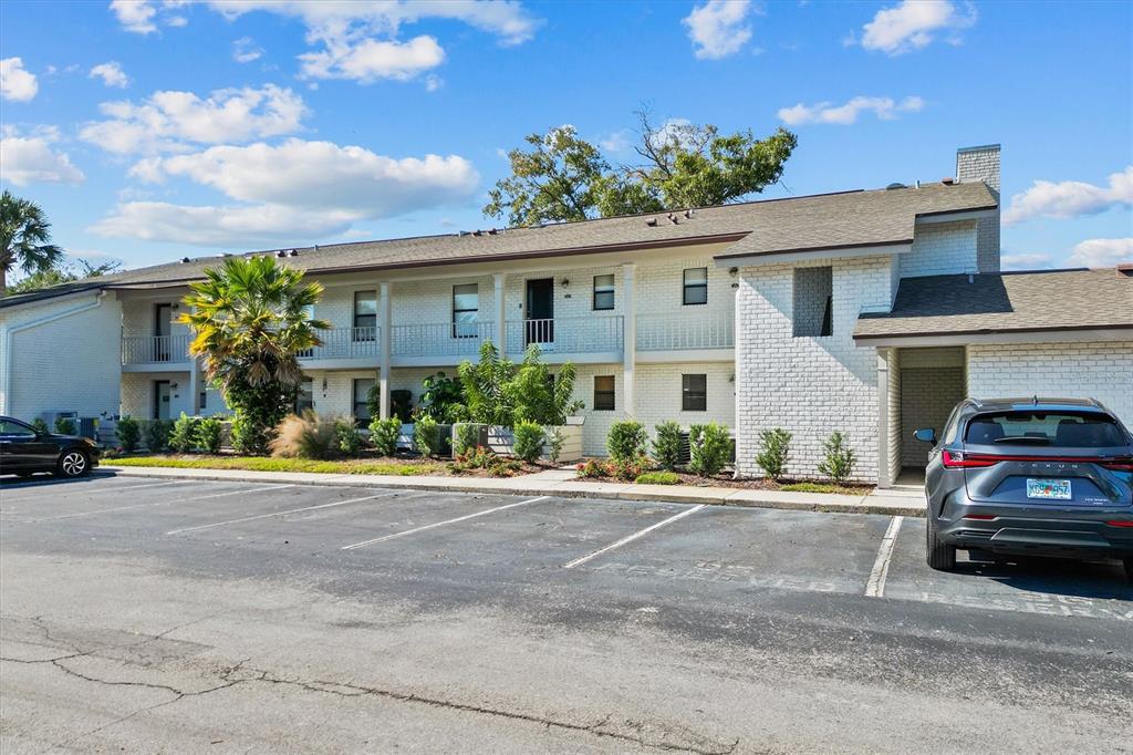 2992 Plaza Terrace Drive, Unit 2992 Orlando, FL 32803 - Photo 25 of 31 a car parked in front of a house