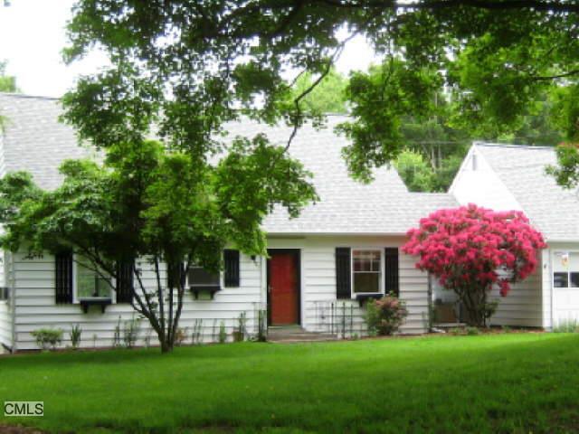 29 Maple Shade Road Ridgefield, CT 06877 - Photo 1 of 1 a front view of a house with a garden and yard