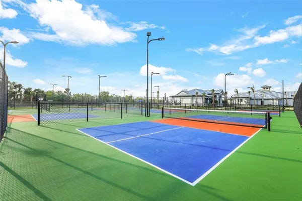 a view of an outdoor space and tennis court