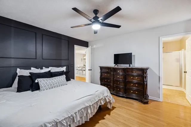 a bedroom with a bed and a tv