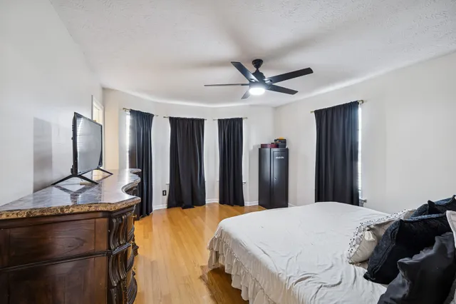 a bed room with a bed and a television