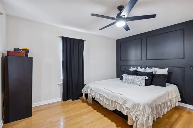 a bedroom with bed and window