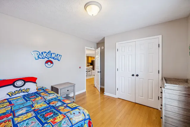 a bedroom with a bed and a closet