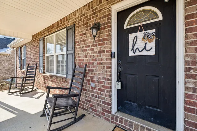a front view of a house with a glass door and shower