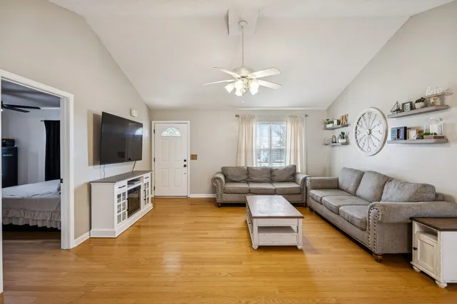 a living room with furniture and a flat screen tv