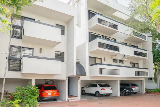 a view of a car park in front of house