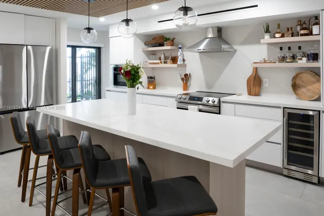 a kitchen with a dining table and chairs
