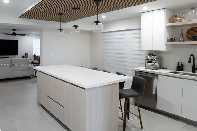 a utility room with sink dryer and washer