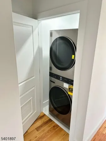 a view of a hallway with washer and dryer