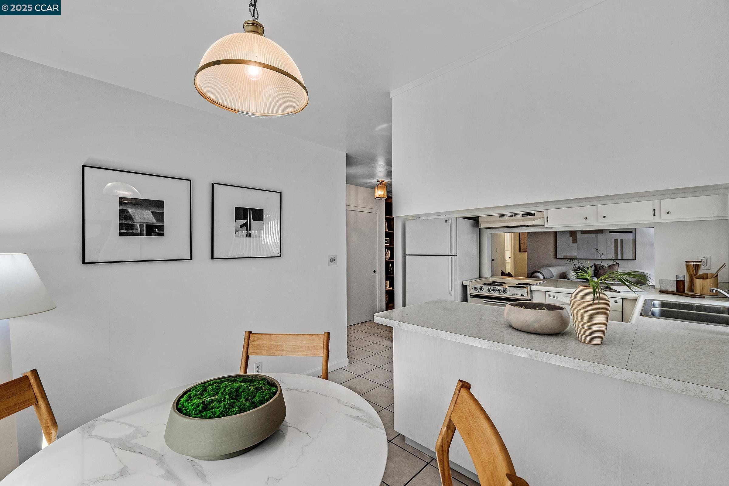 146 Ascot Court, Unit 2 Moraga, CA 94556 - Photo 11 of 33 a living room with furniture a couch and a potted plant