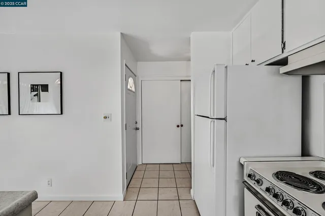 a kitchen with a stove a sink and a refrigerator