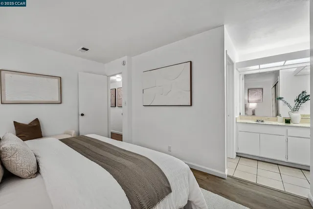 a large white bed in a white room